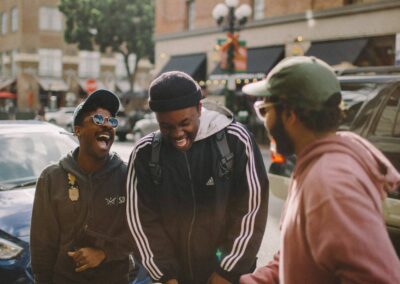 friends laughing city street