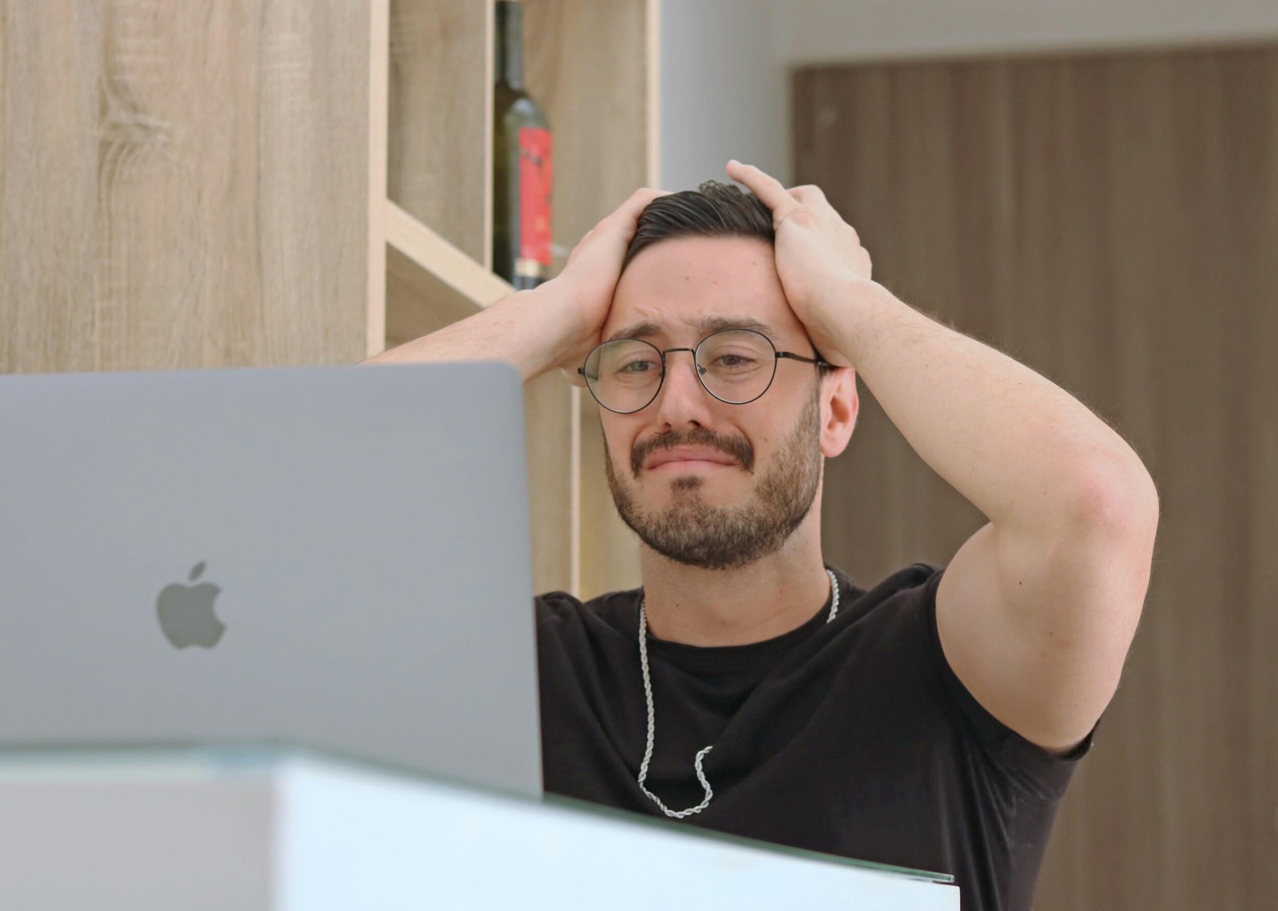 frustrated man using a laptop frustrated man using a laptop