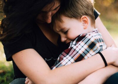 mother hugging young child