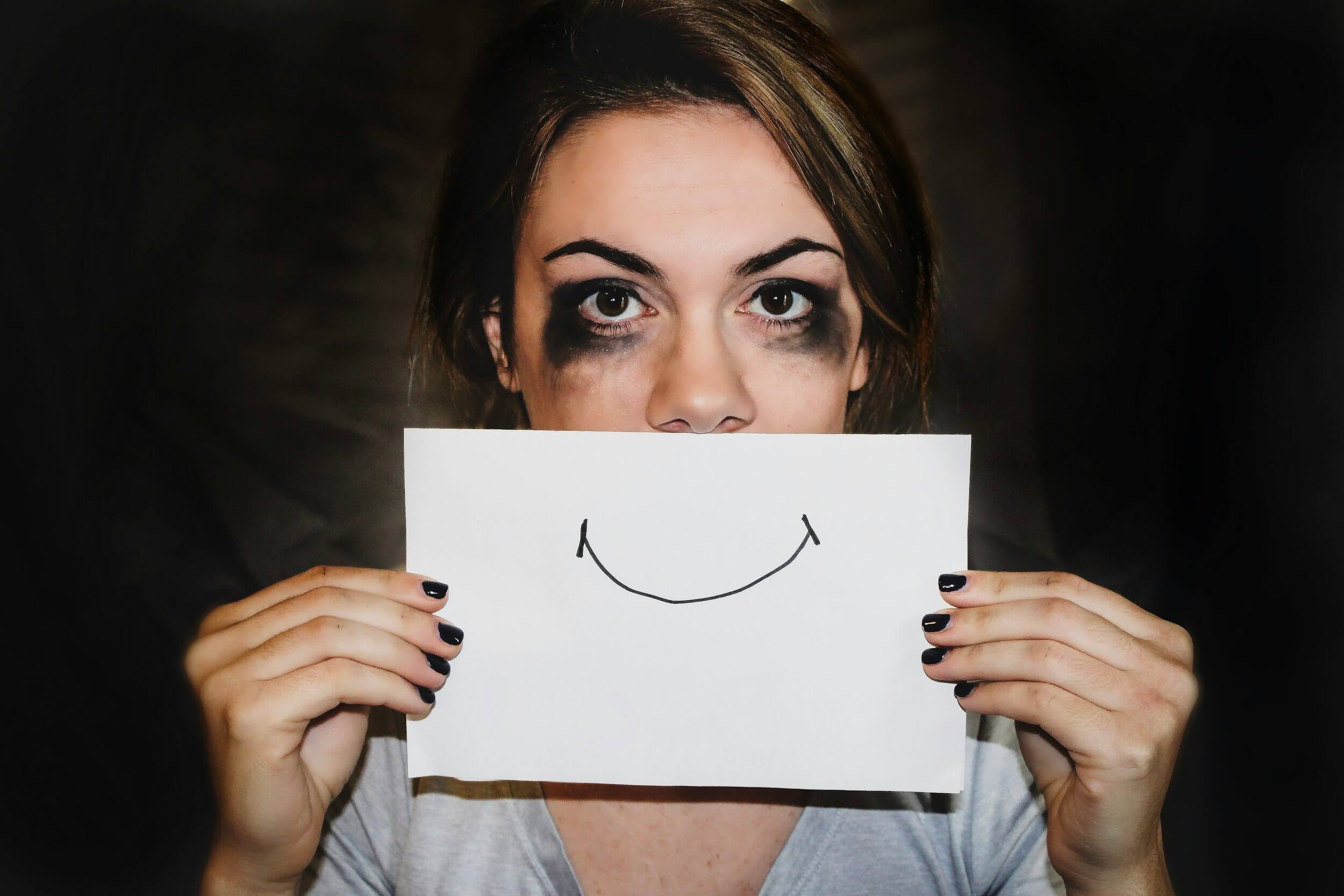 sad woman hiding smile sad woman hiding smile