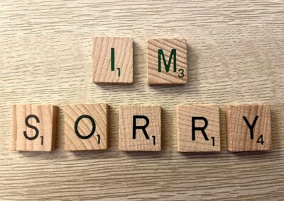scrabble pieces spelling out "IM SORRY"