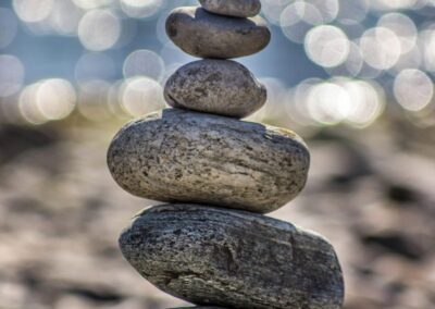 stacked stones near water