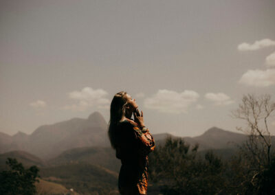 Woman praying with mountain view