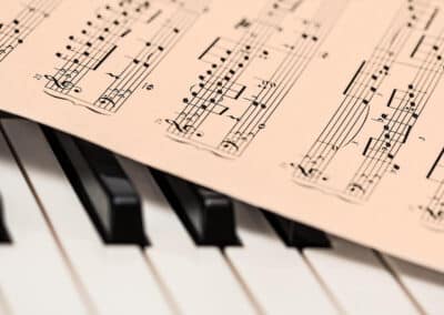 sheet music on piano keys