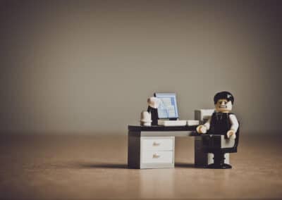 Lego Adult working at his desk