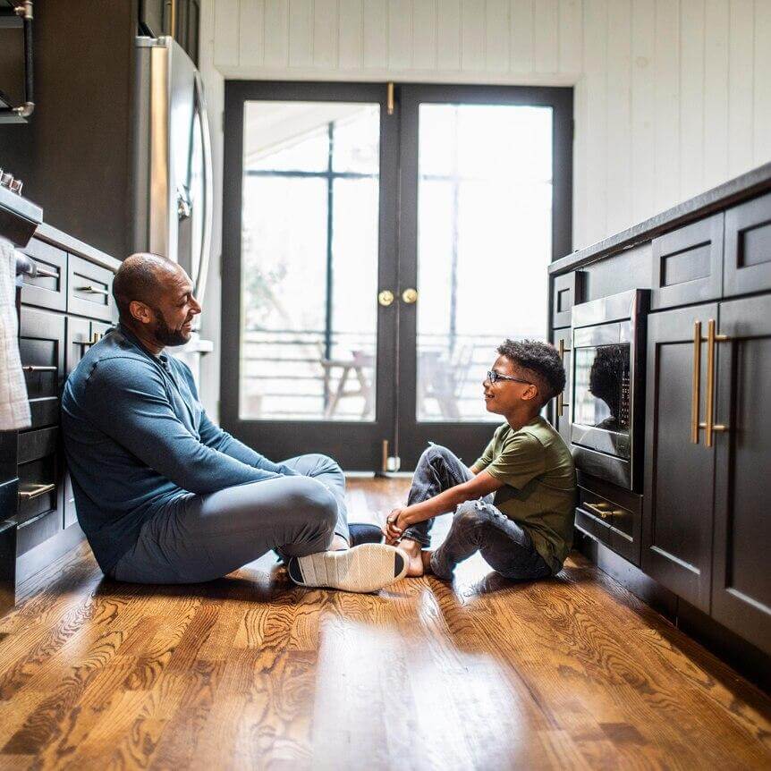 Parent listening to a child talk about worries before starting school